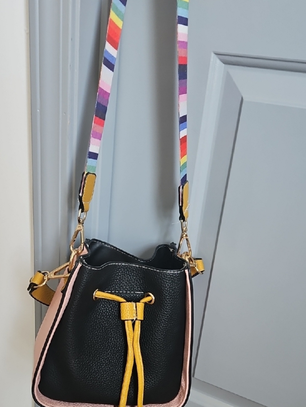 Black and Pink Drawstring Bucket Bag with Yellow Accent